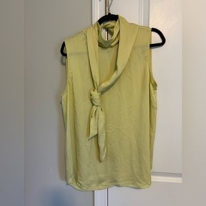 Women’s large sleeveless blouse with tie front. Yellow/green in color.